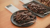 Several platters of chocolate pieces with tongs at Wellington Chocolate Factory in New Zealand