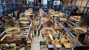 The interior of Riverside Market in Christchurch, New Zealand featuring various food stalls and shops