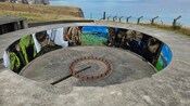 A gun emplacement at Godley Head with a mural depicting scenes from World War 2