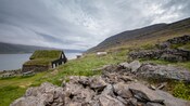 A building in the middle of the Westfjords facing the water