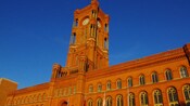 Berlin’s City Hall, an ornamental brick building with domed windows and a central clock tower