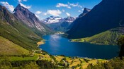 The Hjørundfjord in Norway with mountains and a lush valley