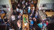 Guests gathered around a table covered with food