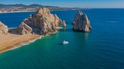 A boat near El Arco, a rock formation in Cabo San Lucas, Mexico
