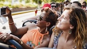 Guests taking pictures on a tour bus in Rome, Italy