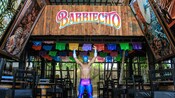 A wrestler in front of a sign that reads, ‘Barriecito’ in Cozumel, Mexico