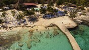 Islands Beach Club with a private pool, beach loungers and umbrellas on a beach in Cozumel, Mexico