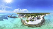 Una isla tropical de arena blanca con exuberante vegetación