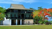 The oldest building in George Town featuring a 3 story building with wraparound porches