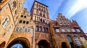 Medieval row buildings with arched entrances