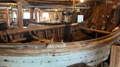 An old boat in a dimly lit room
