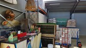 A warehouse setting with a tasting bar and cases of beer and wine