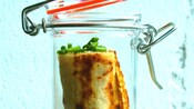 A food item stored in a glass jar with a locking lid