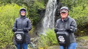 Two women smile atop Segways