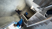 People descending the stairs of a lighthouse 