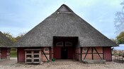 A brick building with a peaked roof in Schleswig Holstein, Germany 