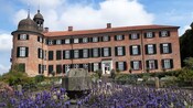 Eutin Castle surrounded by flowers in Eutin, Germany