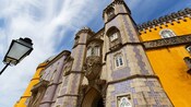 The Triton Gateway at Pena Palace and surrounding walls covered by traditional Portuguese tiles