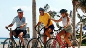 Guests riding bikes along Disney Lookout Cay at Lighthouse Point