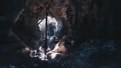 Sunlight streams into the interior of a cave