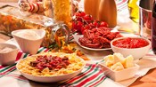 An assortment of pastas, meats and cheeses on a table