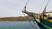 The bow of a boat sailing through the water