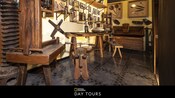 A museum exhibit filled with antique pasta making tools, with text below that says, 'National Geographic Day Tours'
