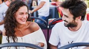 2 Guests on a double decker tour bus in Naples, Spain