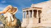A woman in a hat gazing at the Erechtheion in Athens, Greece