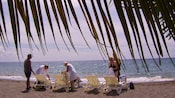 Tourists relaxing on loungers at Mero Beach in Dominica