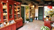 The inside of Kaasboerderij Hoogerwaard featuring cabinets filled with wines and cheese