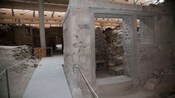 A partially reconstructed dwelling within an archaeological site