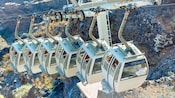Aerial trams over mountains on a sunny day