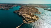 A peninsula populated with buildings and a historic fort
