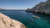 Guests diving together in a cove