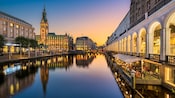 The harbor in Hamburg, Germany with waterfront buildings and cafes
