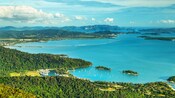 A small marina with sailboats amid forested hills on Langkawi Island, Malaysia