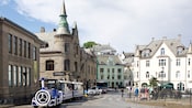 A trolly train next to Jugendstilsenteret in Ålesund, Norway