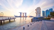 The Merlion fountain pouring into Marina Bay in Singapore The Merlion fountain pouring into Marina Bay in Singapore
