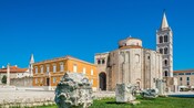 Roman stones sitting near the Archaeological Museum of Zadar, the Church of Saint Donatus and the Cathedral of Saint Anastasia
