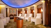 A plush sitting room with a sky painted ceiling at Senses Spa and Salon aboard a Disney ship 