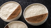 Three Créme de la Créme Martinis, served in bowls with foam and nutmeg topping