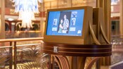 A self service photo kiosk in Pics Photo Shop on board the Disney Adventure