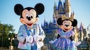 Mickey Mouse and Minnie Mouse, wearing sparkling new looks for The World’s Most Magical Celebration in honor of Walt Disney World Resort's 50th anniversary.