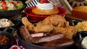 A skillet filled with fried chicken and barbecue ribs