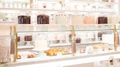 Counters lined with cakes, cookies and other enticing baked goods at The Cake Bake Shop on Disney’s Boardwalk