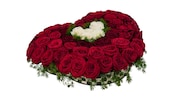 A Mickey Mouse shaped floral arrangement featuring dozens of roses