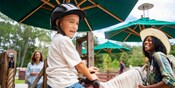 A young Guest enjoying a pony ride at Disney’s Fort Wilderness Resort and Campground at Walt Disney World Resort