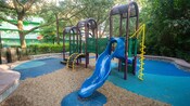 A small playground area with a slide and climbing features