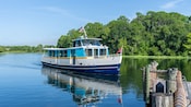 A water taxi approaching a dock at Disney's Wilderness Lodge